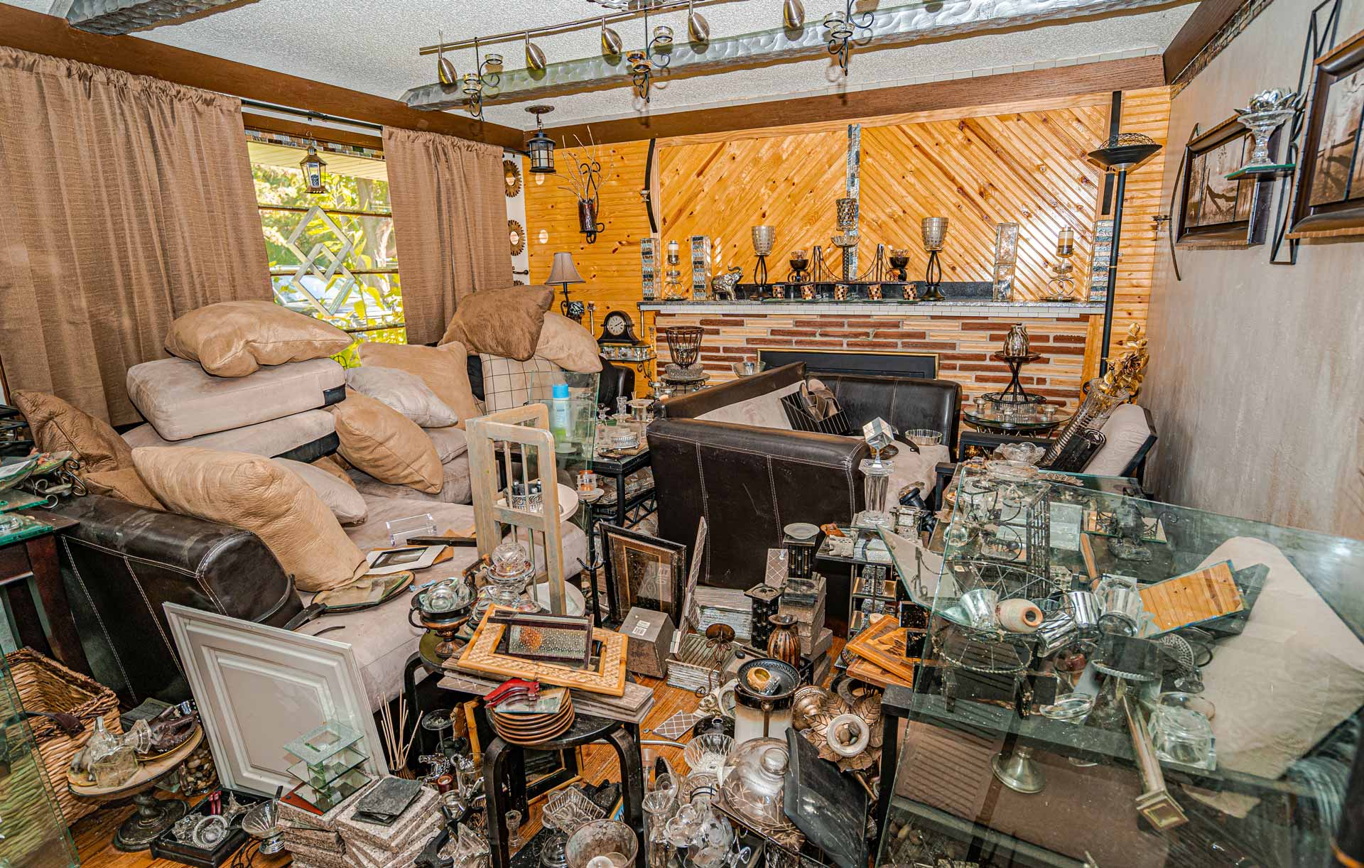 Living room an a house, filled with clutter and old junk